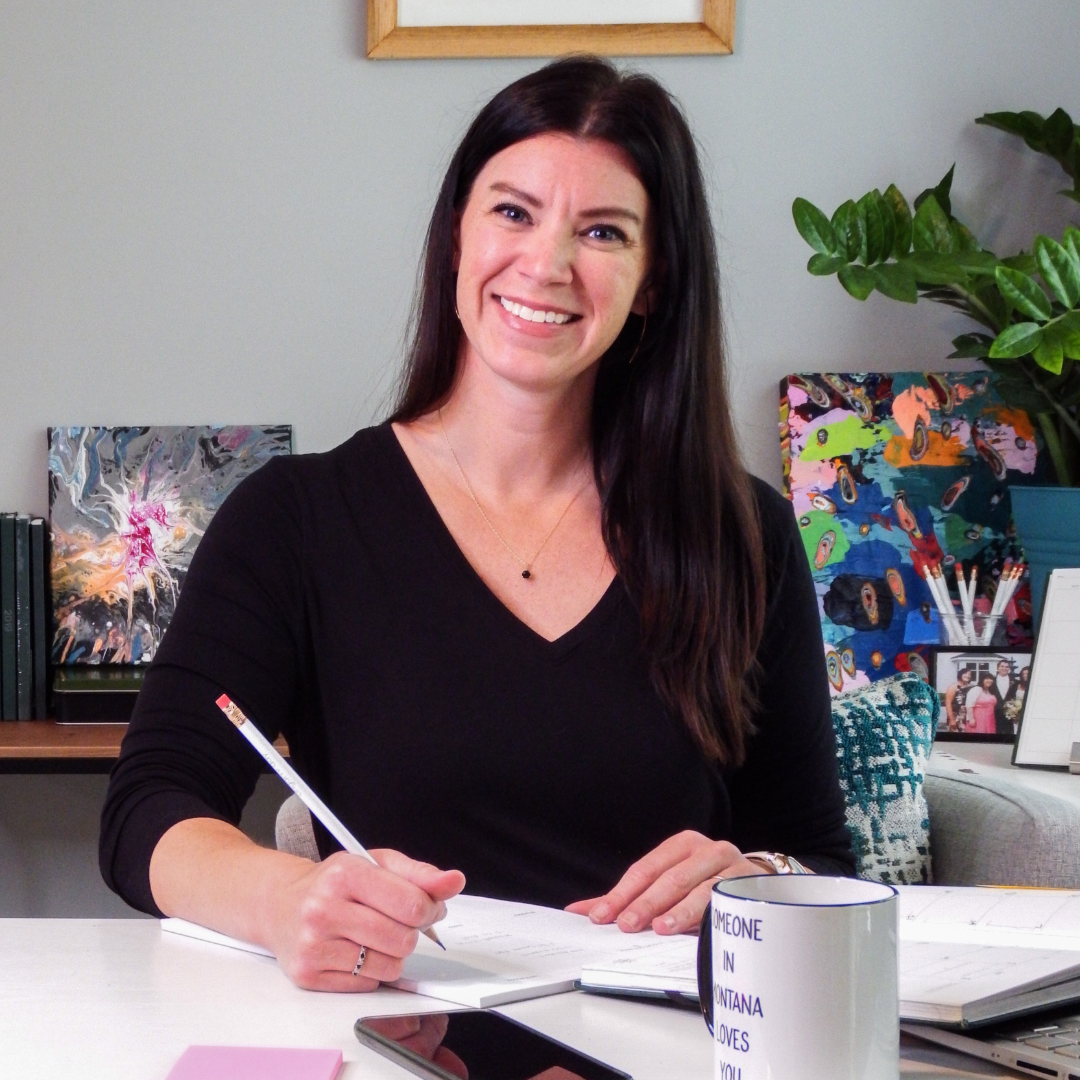 Samantha Lane making notes for clients about time management and work-life balance